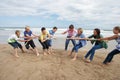 Teenagers playing tug of war