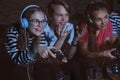 Teenagers playing video games at home late in the evening Royalty Free Stock Photo