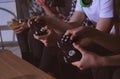 Teenagers playing video games at home late in the evening, closeup Royalty Free Stock Photo