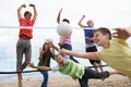 Teenagers playing volleyball