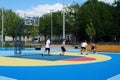 Teenagers plays streetball at new sport zone at expocenter, Kyiv, Ukraine