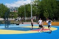 Teenagers plays streetball at new sport zone at expocenter, Kyiv, Ukraine