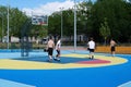 Teenagers plays streetball at new sport zone at expocenter, Kyiv, Ukraine