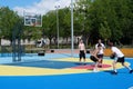 Teenagers plays streetball at new sport zone at expocenter, Kyiv, Ukraine