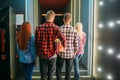 Teenagers with popcorn stands in cinema hall