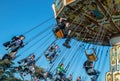 Teenagers ride the chairs at a travelling funfair Royalty Free Stock Photo