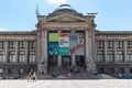 Teenagers are sitting in front of Art Gallery in downtown Vancouver