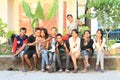 Teenagers sitting on railings in Labuan Bajo