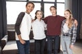 Teenagers standing together and smiling at camera indoors, teenagers having fun concept