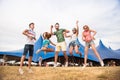 Teenagers at summer music festival dancing and jumping Royalty Free Stock Photo