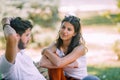 Teenagers talking while  sitting together in park Royalty Free Stock Photo