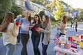 Teenagers talking in the street at a block party