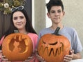 Teenagers with their carved pumpkins at Halloween