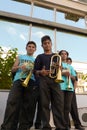 Teenagers from traditional Serbian band posing with trumpets.