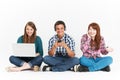 Teenagers Using Different Forms Of Digital Technology In Studio Royalty Free Stock Photo