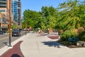 Teenagers walk along a city sidewalk at summer in Coeur d`Alene Idaho USA