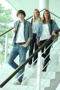 Teenagers walking down stairs Royalty Free Stock Photo