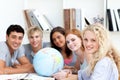 Teenagers working with a terrestrial globe
