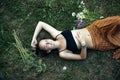 A teengirl is lying on the green grass, a picture from above. Royalty Free Stock Photo