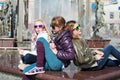 Teen girls against a city fountain