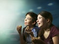 Teens boy and girl watching horror movie film Royalty Free Stock Photo