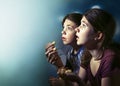 Teens boy and girl watching horror movie film Royalty Free Stock Photo