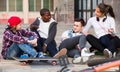 teens chatting near bikes