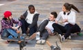 teens chatting near bikes