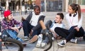 Teens chatting near bikes Royalty Free Stock Photo