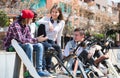 teens chatting near bikes