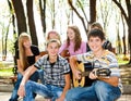 Teens crowd in park Royalty Free Stock Photo