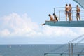 Teens on diving board Royalty Free Stock Photo