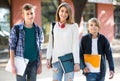 Teens going to school with papers Royalty Free Stock Photo