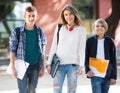 teens going to school with papers Royalty Free Stock Photo