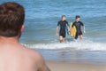 Teens having fun with bodyboard at beach