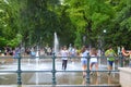 Teens enjoy park fountain