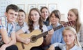 teens having fun and playing guitar and singing Royalty Free Stock Photo