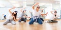 Teens hip hop dancers posing on knees