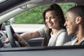 Teens looking at dashboard in car Royalty Free Stock Photo