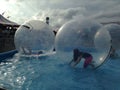 Teens playing in water balls