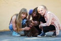 Happy teen girls with a puppy