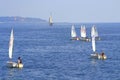 Teens sailing boats race Royalty Free Stock Photo