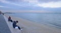 Teens at the seafront of the Tajo bay in Lisbon