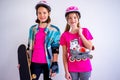 Teens with skateboards and rollerskates Royalty Free Stock Photo