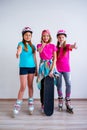 Teens with skateboards and rollerskates Royalty Free Stock Photo