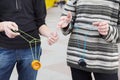 Teens with yo-yo toys in hands. focus on clothes