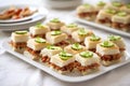 teeny bbq sandwiches for a party, white plates