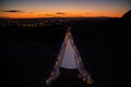 Teepee during dark sunset in quarry Hady Brno with view on city centre