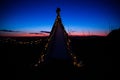 Teepee during dark sunset in quarry Hady Brno with view on city centre