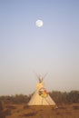 Teepee and full moon at dusk in Malibu, CA Royalty Free Stock Photo